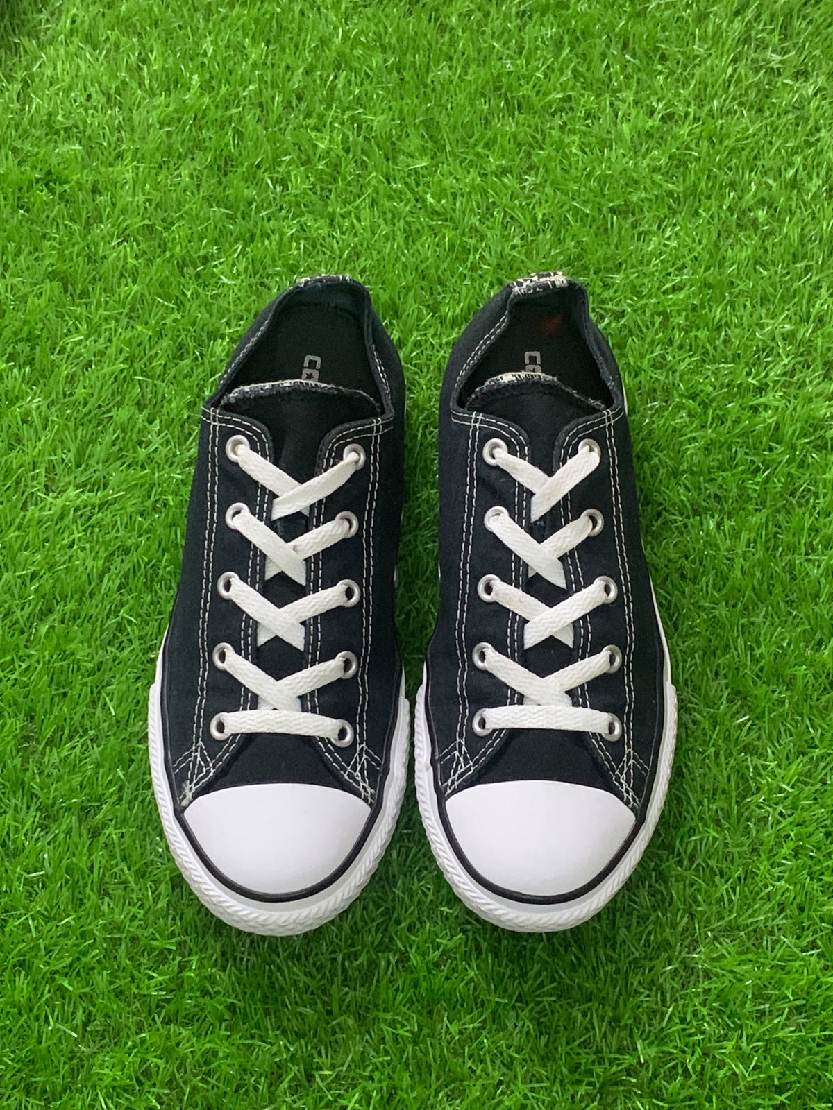 Converse black junior low-top pair front photo