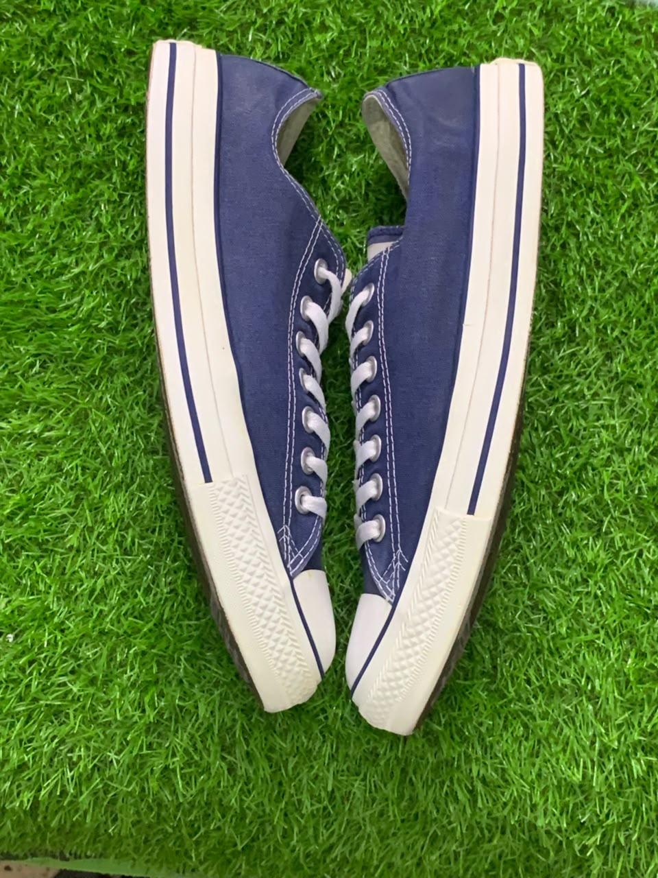 Converse Chuck Taylor navy low-top pair opposite side view