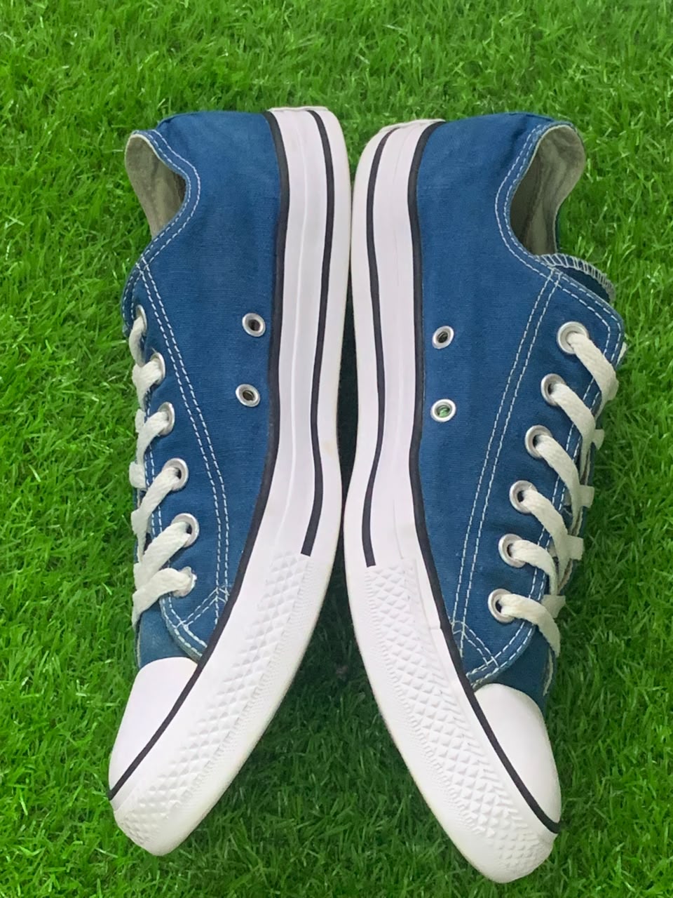Converse Chuck Taylor blue low-top pair opposite side view