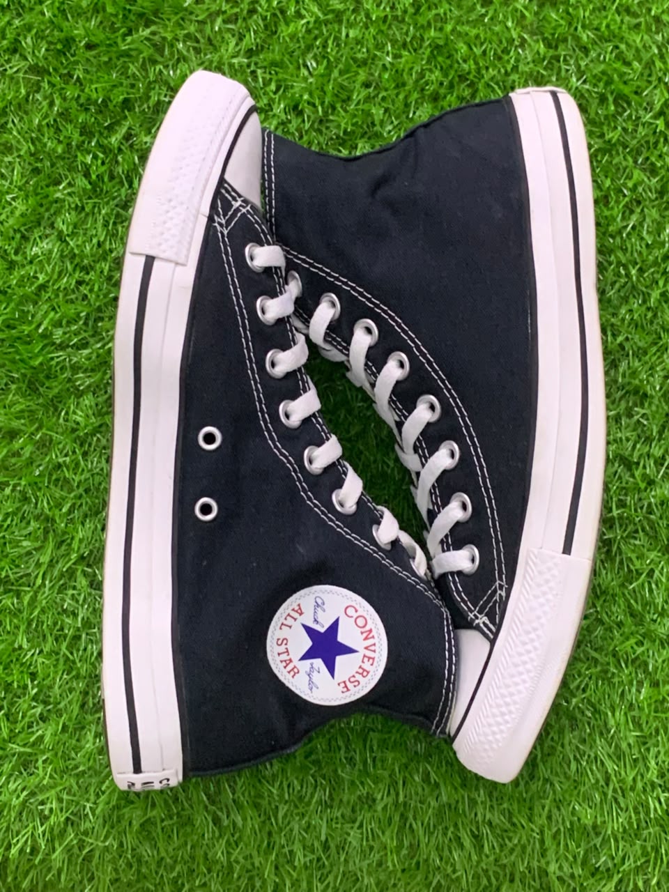 Converse Chuck Taylor black high-top side view with All Star ankle patch