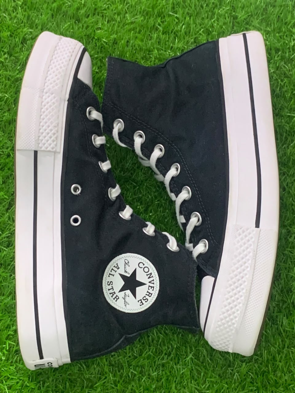 Converse Chuck Taylor black canvas high-top side view with ankle patch