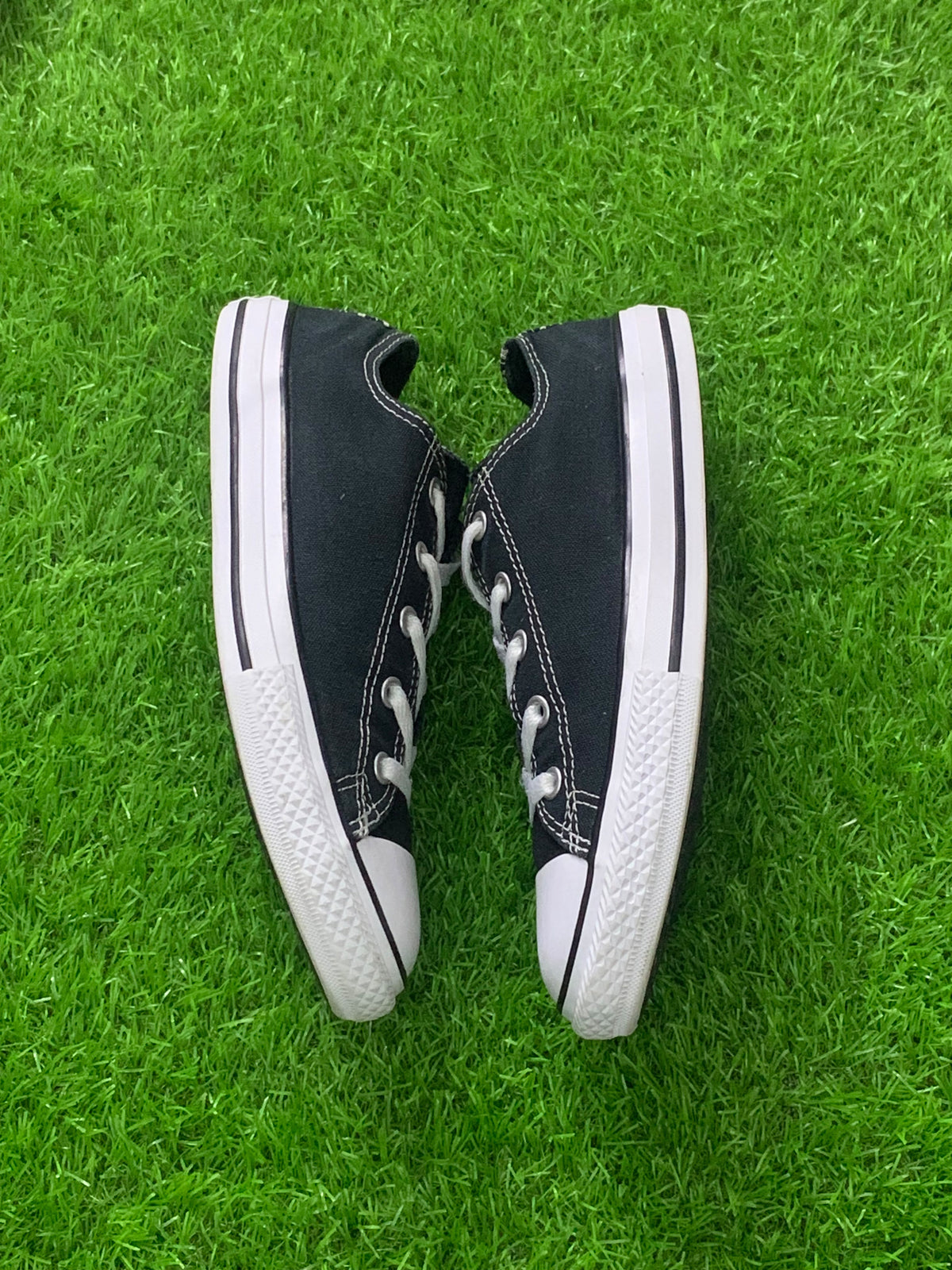 Converse black junior low-top pair side photo