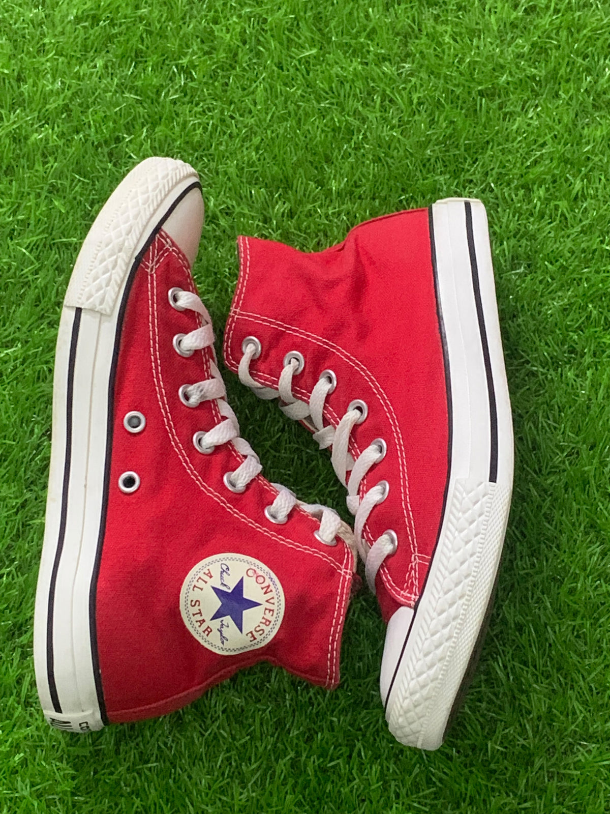 Converse red youth high-top pair side view